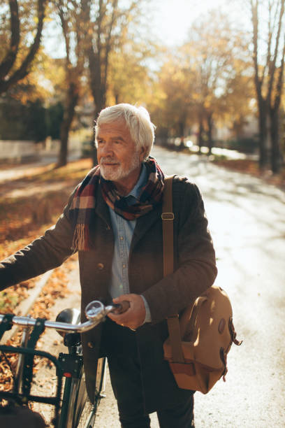istock Stylish, senior man on a bicycle 866051930