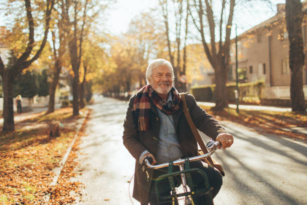 istock Stylish, senior man on a bicycle 866052402