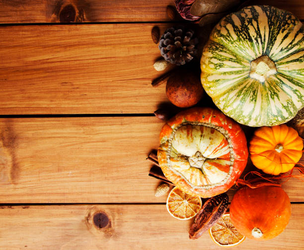 istock Seasonal wooden table setting with small pumpkins 866059078