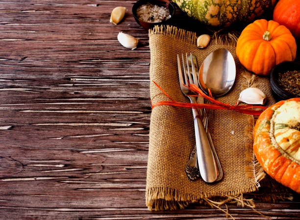 istock Seasonal wooden table setting with small pumpkins 866059304