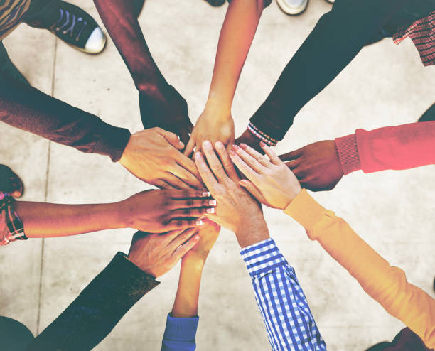istock Aerial view of supported hands out together 866059338