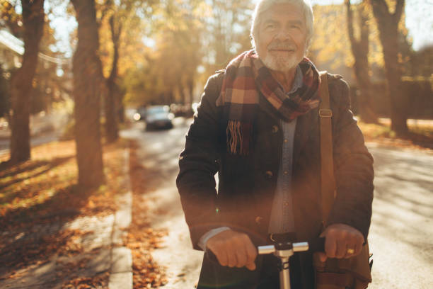 istock Fashionable senior man on a push scooter 866059804