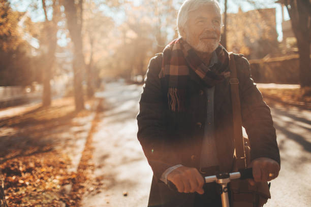 istock Fashionable senior man on a push scooter 866060026