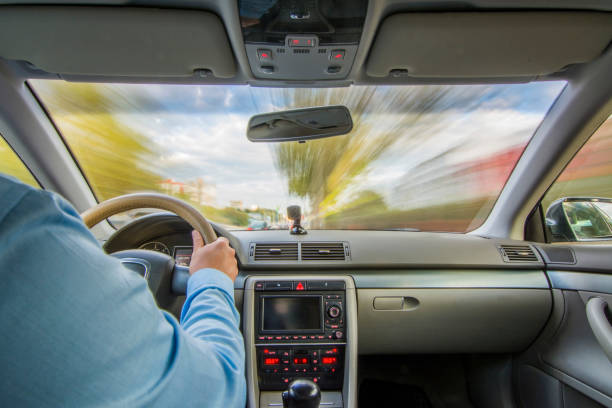 istock Inside a car - driving in the city on a cloudy day 866064710