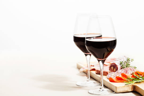 Red wine and snacks Red wine and charcuterie assortment on the board charcuterie stock pictures, royalty-free photos & images