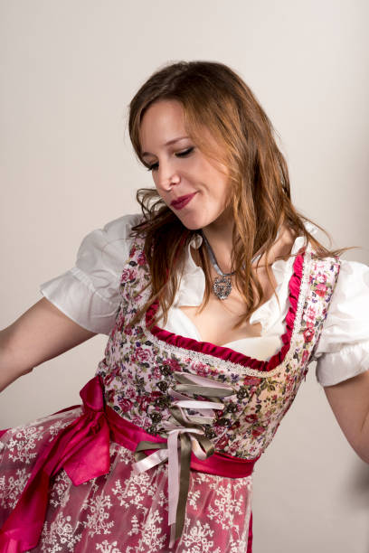 istock Young Woman in Floral Dirndl on White Background 866073218