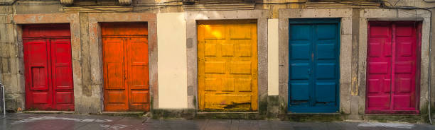 istock Colored front doors, old facade of building, close up. 866078346