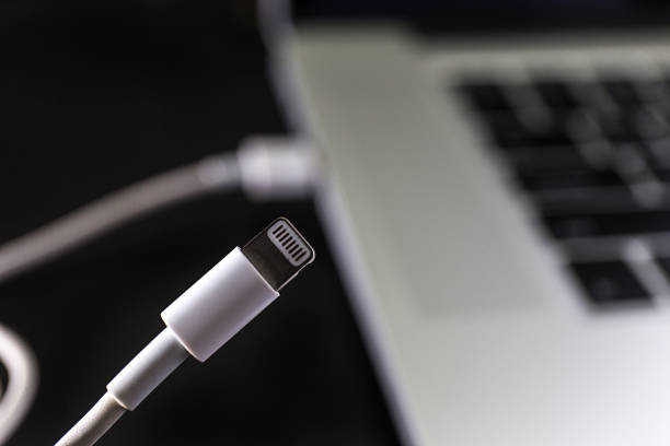 istock USB flash cards and thumb drive or stick Virtual memory storage with USB cable into slot  laptop computer 866080018