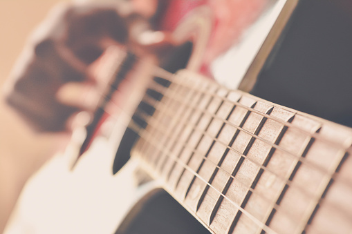 Playing Acoustic guitar