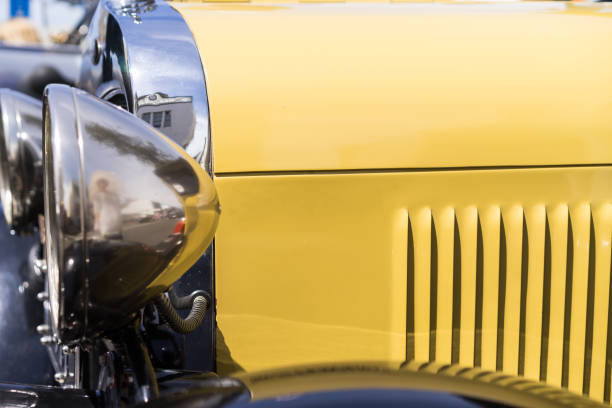 istock A close up look at an old classic yellow car. 866092102