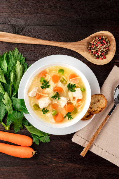 istock Chicken soup with noodles, overhead photo with copyspace 866095216