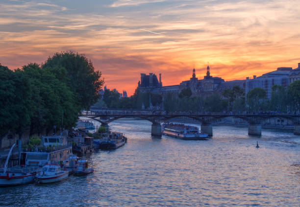 istock Dramatic sunset over river Seine in Paris, France 866096610
