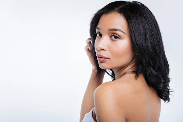 istock Slender young woman posing in off the shoulders top 866097244
