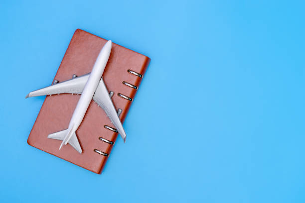istock Airplane on a Note for Business travel concept with blue copy space 866100194
