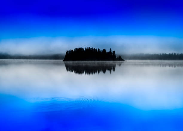 istock Norway centered island fog lake 866100538