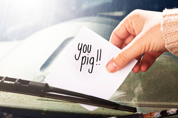 istock Woman's hand placing angry note 