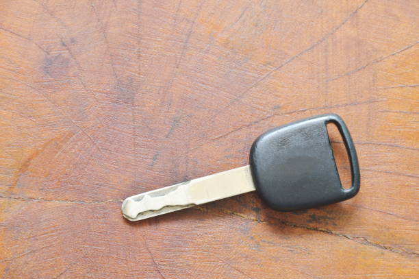 istock car key on wooden table 866103562