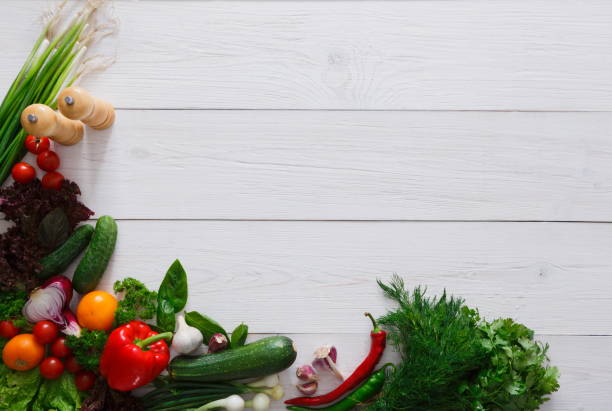 istock Fresh vegetables border on white wood background with copy space 866108930