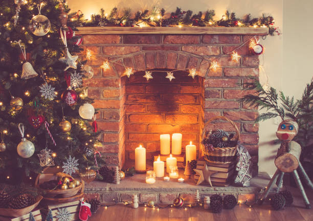 istock Christmas decorated room with fireplace and candles 866109056