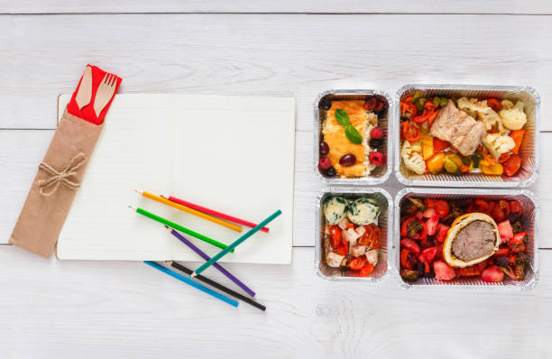 istock Healthy food, lunch in foil box on student table, diet 866111722