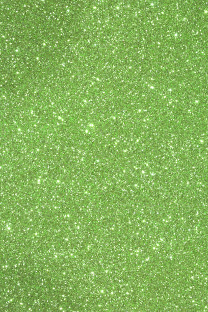 istock Green shimmering background with glittering lights and reflectio 866112176