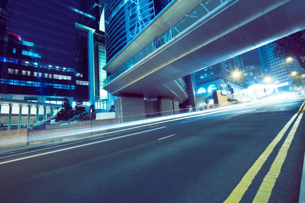 istock traffic trails in downtown hong kong 866115580