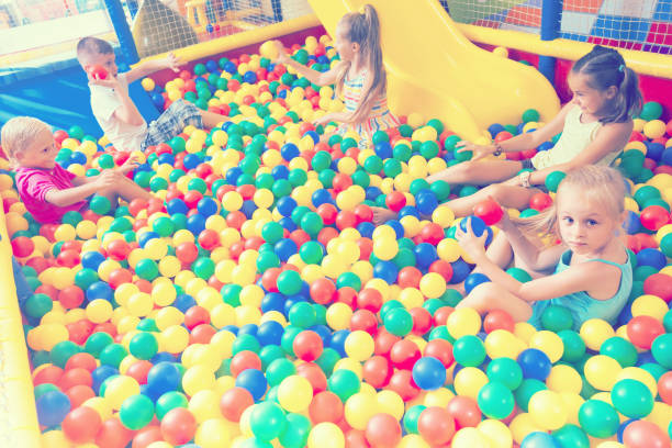 istock children playing together in pool with plastic multicolored balls 866123466