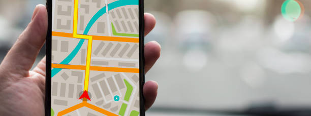 istock GPS Navigation on Mobile Phone Device and Transportation Concept. Male Hand Using Navigation System Map Tracking on Smartphone with Copy Space. 866127488