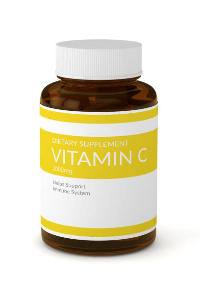 3d render of vitamin C pills in bottle stock photo