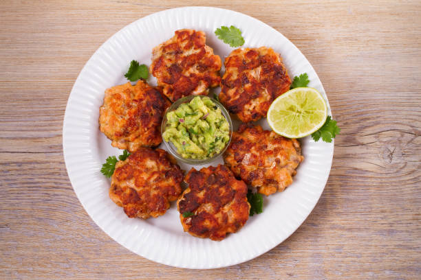 istock Salmon burgers with avocado salsa. Salmon cakes 866132018
