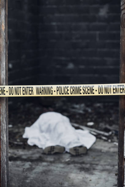 istock Dead body in a room that is covered by a cordon tape 866132848