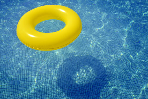 istock Colorful inflatable tube floating in swimming pool 866142848
