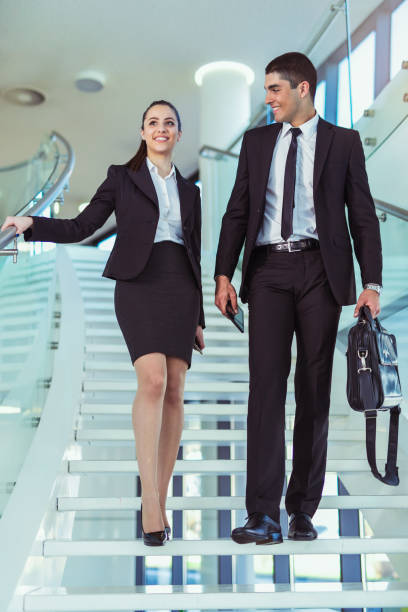 istock Business colleagues talking on stairs 866143514