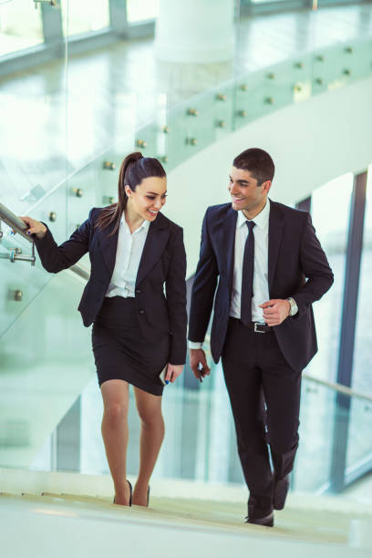 istock Business colleagues talking on stairs 866143610