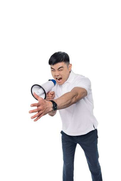 istock angry asian man with bullhorn 866143620