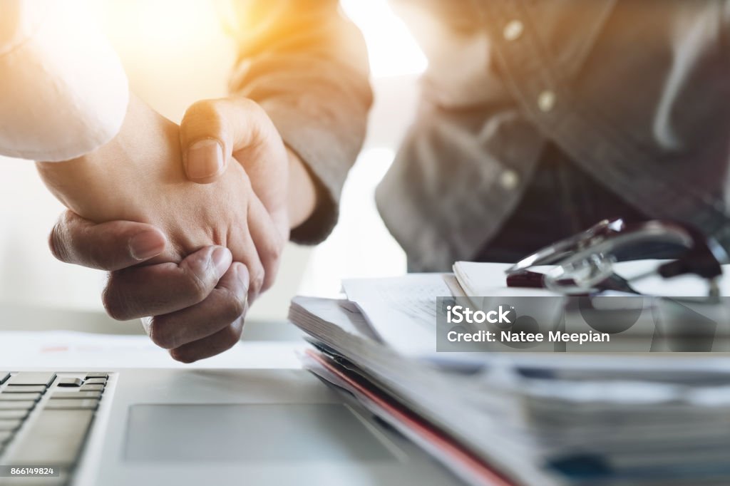 Close up of Business people shaking hands, finishing up meeting, business etiquette, congratulation, merger and acquisition concept Agreement Stock Photo