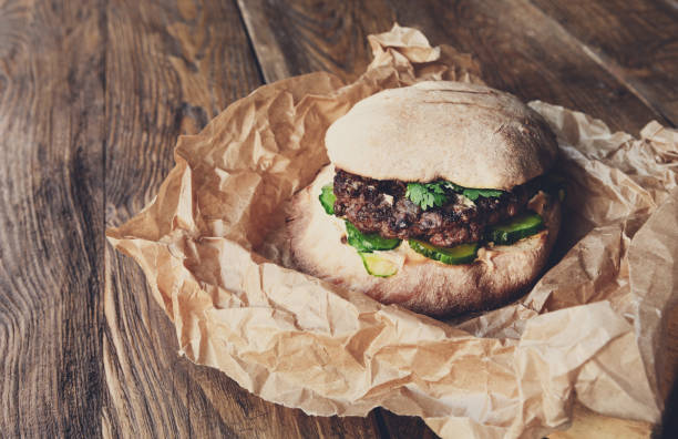 istock Classic american burger, fast food on wood background 866151012