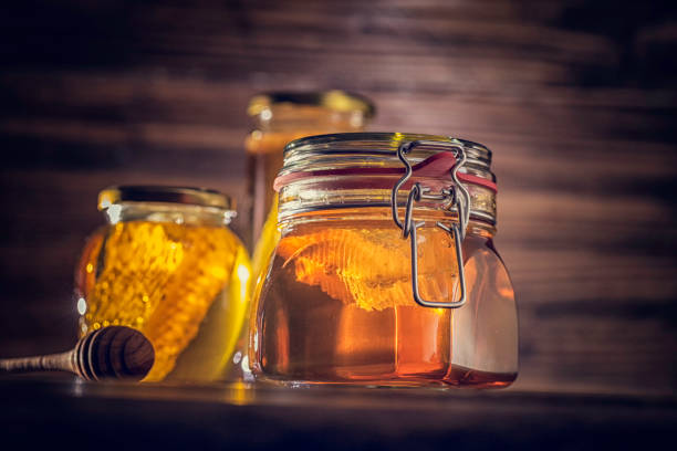 istock Honey with Honeycombs in a Jar 866161888