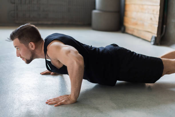 istock Young man fitness workout, push ups or plank 866162540