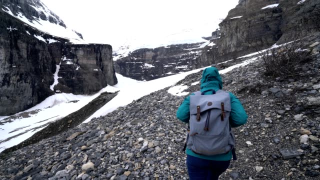 Woman hiking on glacier in Canada