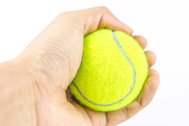 istock beautiful hands holding tennis ball 866165778