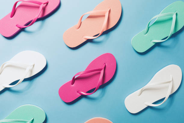 Flip flops on the blue background Overhead view of flip flops on the blue background. Horizontal animal representation photos stock pictures, royalty-free photos & images