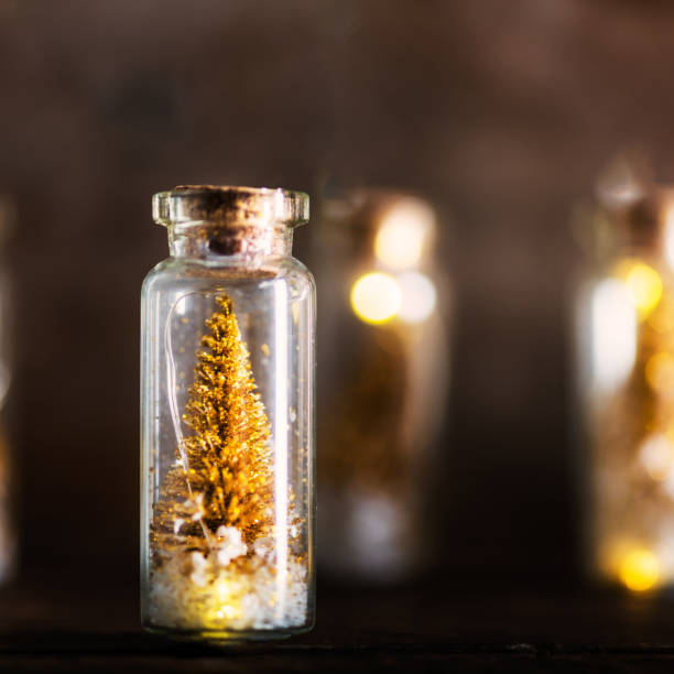 istock Miniature Gold Christmas Trees in Glass Baubles 866169622
