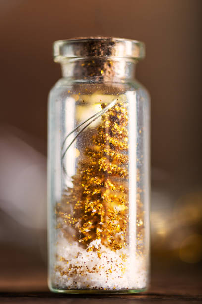 istock Miniature Gold Christmas Trees in Glass Baubles 866173616