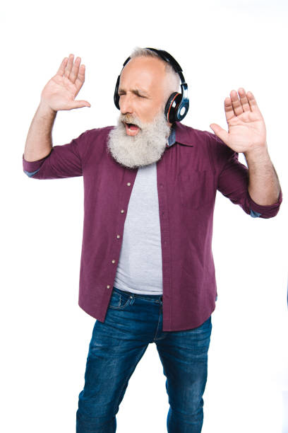 istock senior man with headphones 866174580