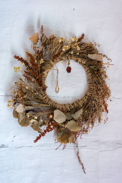 istock wreath of flowers on white wall 866174588