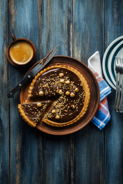 Italian walnut cake crostata with chocolate and hazelnuts. and coffee Italian walnut cake crostata with chocolate and hazelnuts. and coffee crostata photos stock pictures, royalty-free photos & images