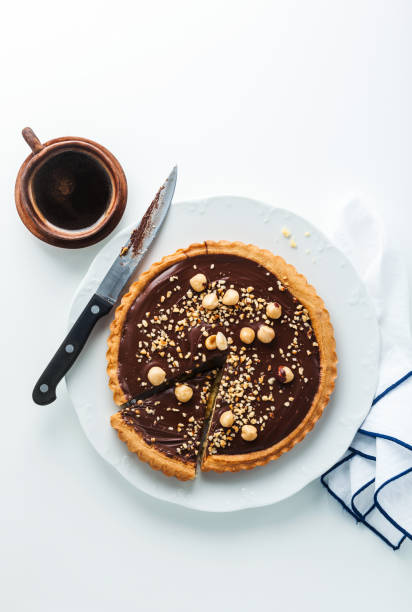 Italian walnut cake crostata with chocolate and hazelnuts. and coffee Italian walnut cake crostata with chocolate and hazelnuts. and coffee crostata stock pictures, royalty-free photos & images