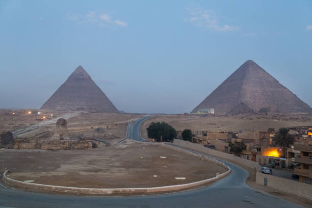 istock Road to the Great Giza Sphinx and pyramids at dawn. 866178214