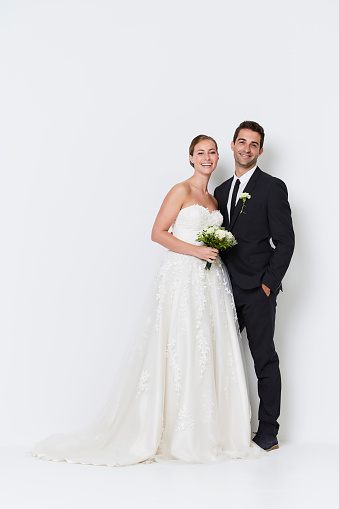 Beautiful happy couple in wedding attire, portrait